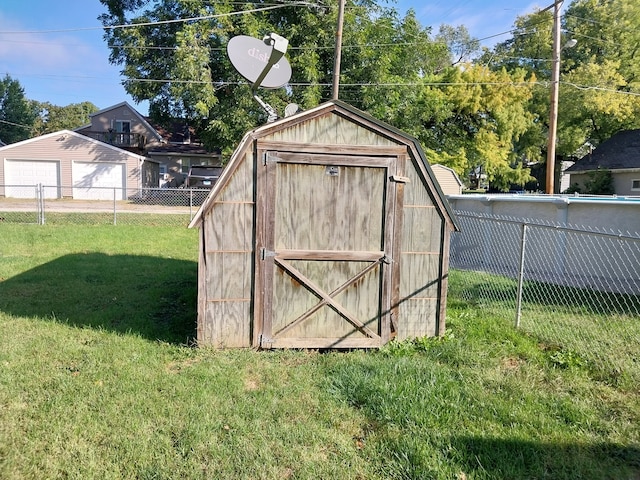 view of outdoor structure featuring a yard