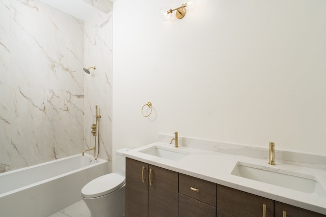 full bathroom with tiled shower / bath, vanity, and toilet