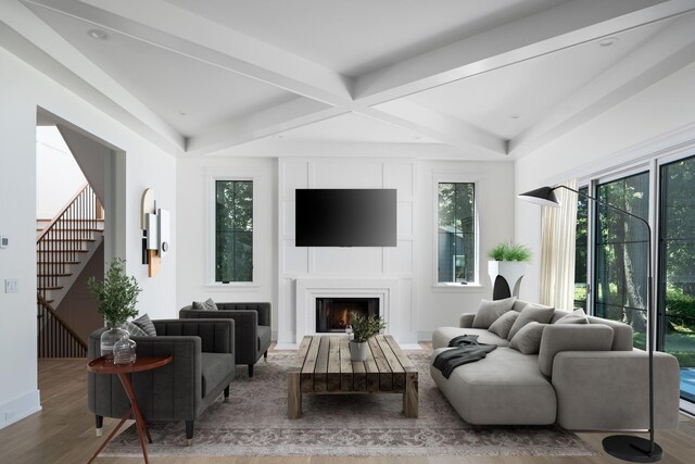 living room featuring beam ceiling and hardwood / wood-style floors