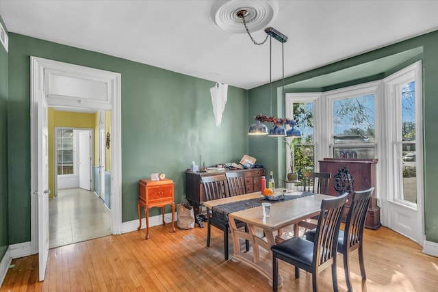 dining space with light wood-type flooring