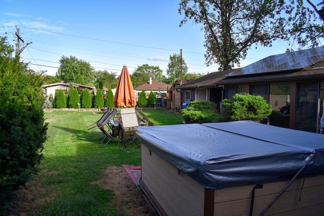 view of yard with a hot tub