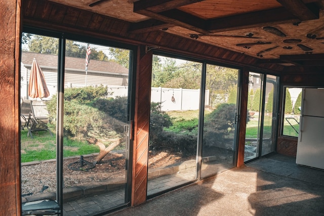 entryway featuring carpet flooring and wooden ceiling