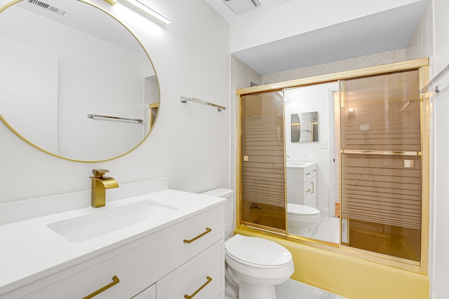 full bathroom featuring combined bath / shower with glass door, vanity, and toilet