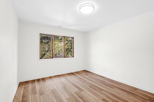 empty room with light hardwood / wood-style floors