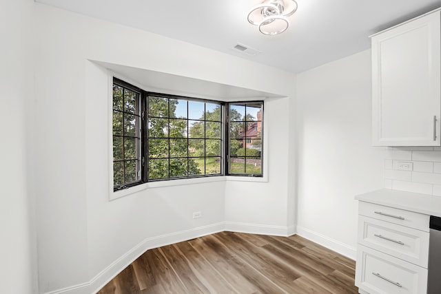 unfurnished dining area featuring light hardwood / wood-style floors