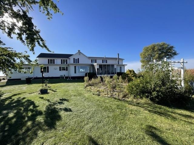 17580 1200 E St, Wyanet, IL 61379 - view of green lawn featuring a sunroom