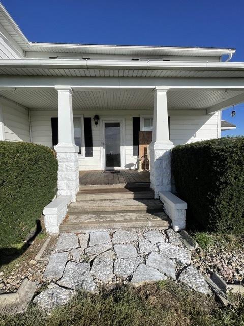17580 1200 E St, Wyanet, IL 61379 - view of exterior entry featuring covered porch