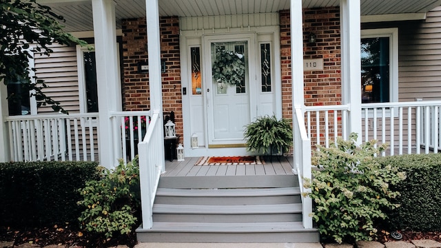 doorway to property with covered porch