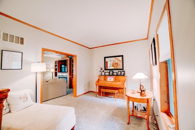 bedroom featuring visible vents, baseboards, ornamental molding, and carpet flooring