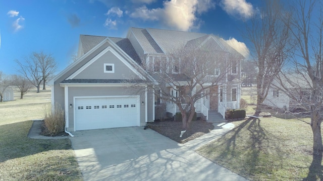 view of front of property with a front yard, a garage, driveway, and roof with shingles