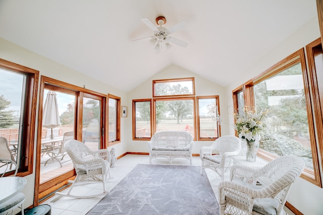 sunroom / solarium with ceiling fan and vaulted ceiling