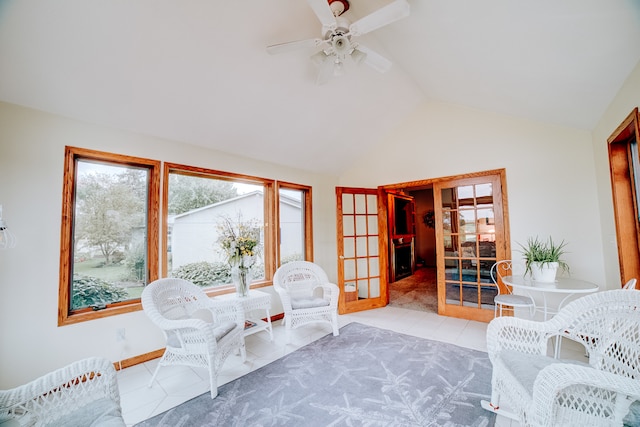 sitting room featuring vaulted ceiling, ceiling fan, and light tile patterned flooring