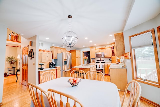 dining room with visible vents, baseboards, recessed lighting, light wood-style flooring, and a notable chandelier