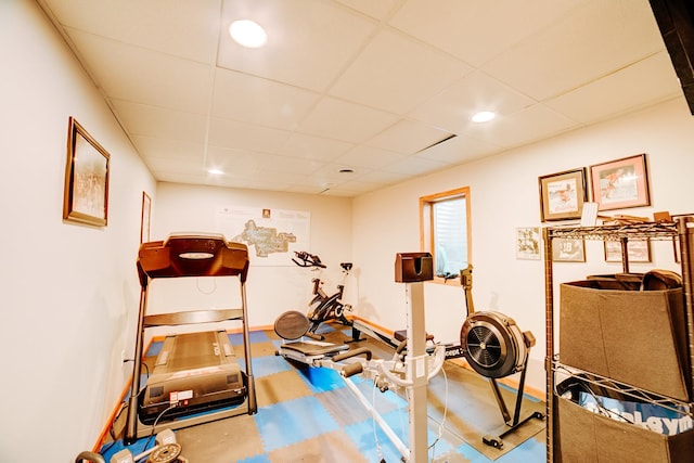 exercise area with recessed lighting and a paneled ceiling