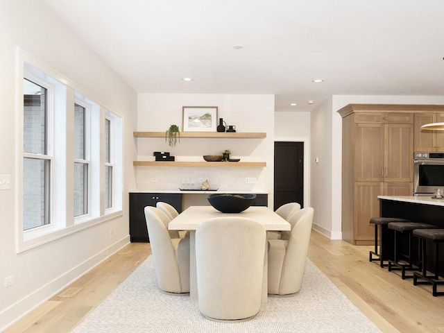 dining room with light hardwood / wood-style floors