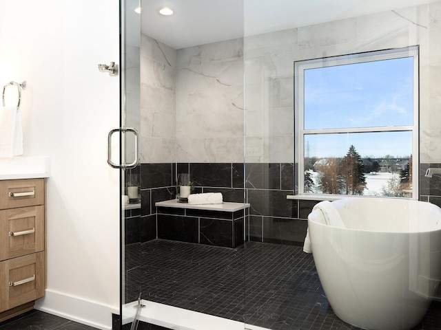 bathroom featuring vanity, tile patterned flooring, and plus walk in shower