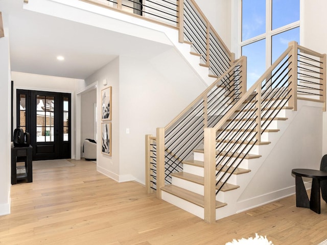 1519 77th St, Naperville, IL 60565 - entryway with wood finished floors, stairway, baseboards, recessed lighting, and a towering ceiling