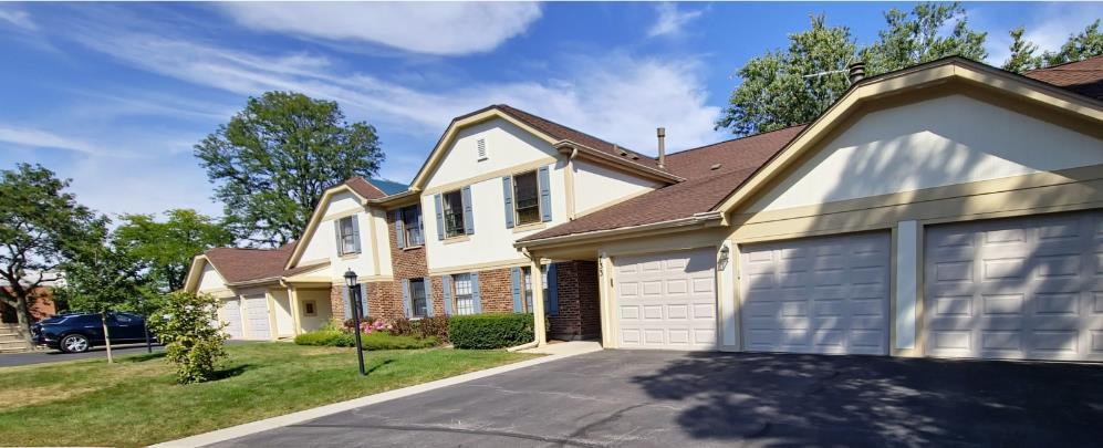 view of front facade with a front lawn and a garage