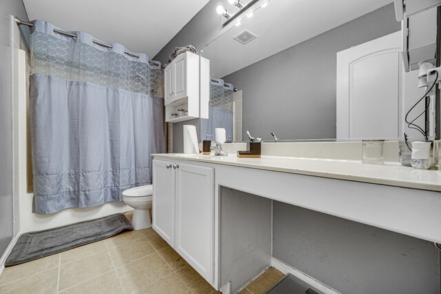 bathroom featuring vanity, tile patterned flooring, toilet, and a shower with shower curtain