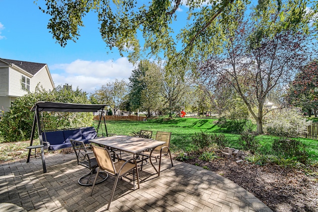 deck with a lawn and a patio area