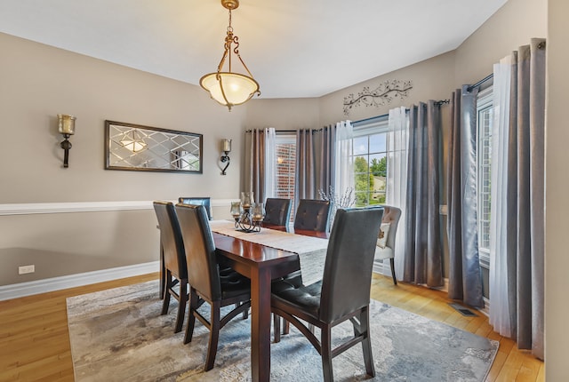 dining space with light wood-type flooring