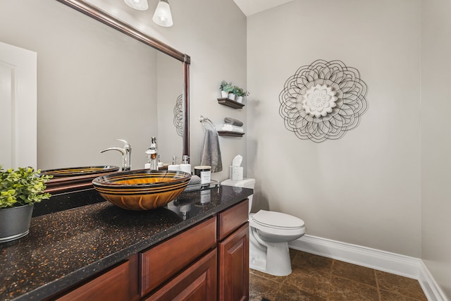 bathroom with toilet and vanity