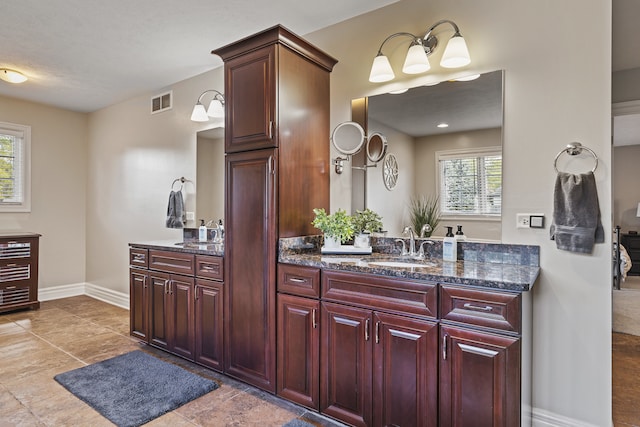 bathroom with wine cooler, vanity, and a textured ceiling