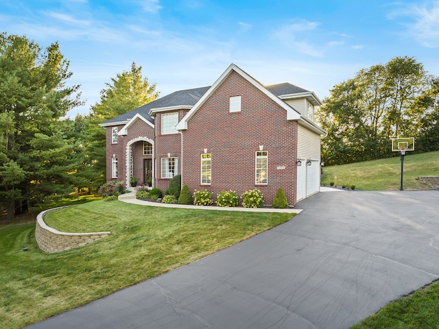 view of front property with a garage and a front yard