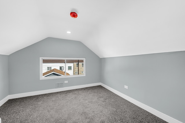 bonus room featuring carpet floors and lofted ceiling