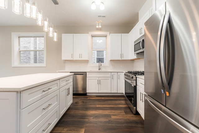 4902 S Vincennes Ave Unit 1, Chicago, IL 60615 - kitchen with a sink, visible vents, backsplash, light countertops, and appliances with stainless steel finishes
