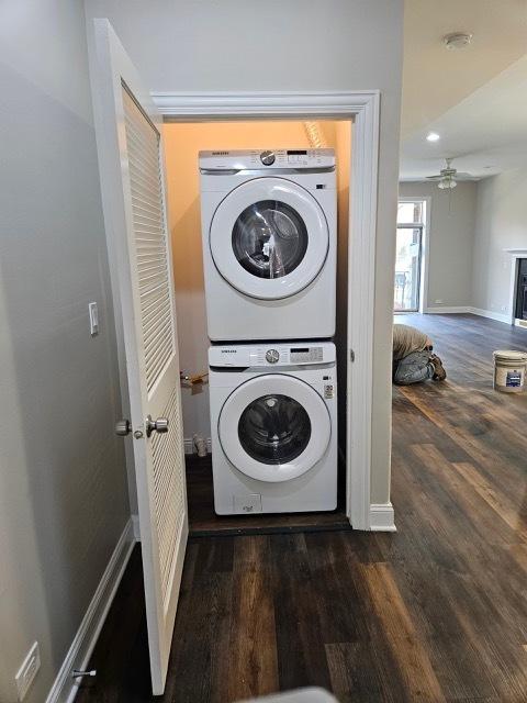4902 S Vincennes Ave Unit 1, Chicago, IL 60615 - laundry area with baseboards, wood finished floors, stacked washer and clothes dryer, ceiling fan, and laundry area