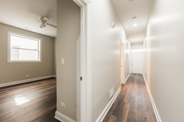 hall featuring dark wood-type flooring