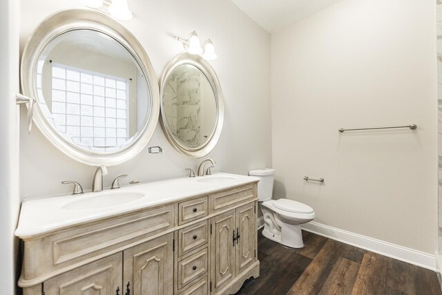 4902 S Vincennes Ave Unit 1, Chicago, IL 60615 - full bathroom featuring wood finished floors, toilet, baseboards, and a sink