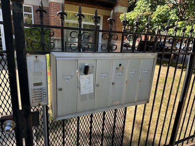 4902 S Vincennes Ave Unit 1, Chicago, IL 60615 - view of gate featuring fence
