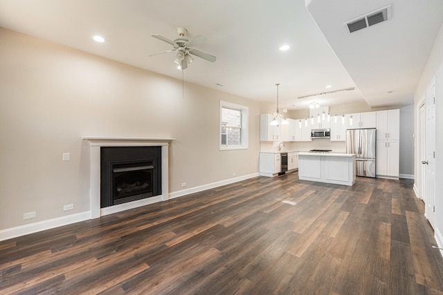 4902 S Vincennes Ave Unit 1, Chicago, IL 60615 - unfurnished living room featuring baseboards, a ceiling fan, dark wood-type flooring, and visible vents