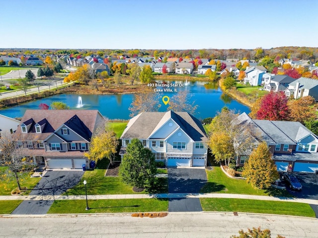 bird's eye view with a water view and a residential view