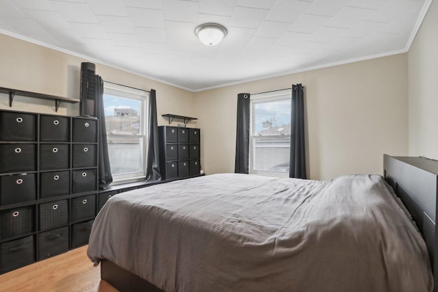 8122 W Oak Ave, Niles, IL 60714 - bedroom with multiple windows, crown molding, and wood finished floors