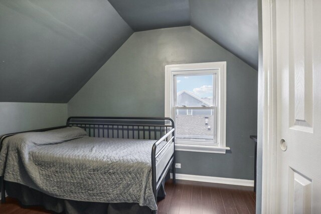 8122 W Oak Ave, Niles, IL 60714 - bedroom featuring dark wood finished floors, lofted ceiling, and baseboards