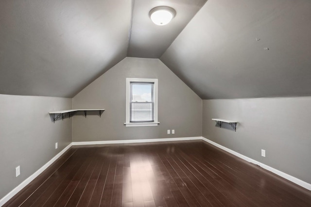 8122 W Oak Ave, Niles, IL 60714 - additional living space featuring wood finished floors, vaulted ceiling, and baseboards