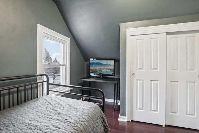 8122 W Oak Ave, Niles, IL 60714 - bedroom featuring vaulted ceiling, dark wood finished floors, baseboards, and a closet