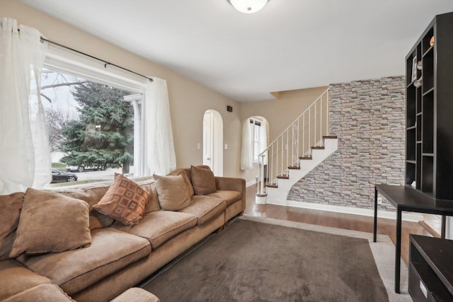 8122 W Oak Ave, Niles, IL 60714 - living area with wood finished floors, arched walkways, stairs, and baseboards