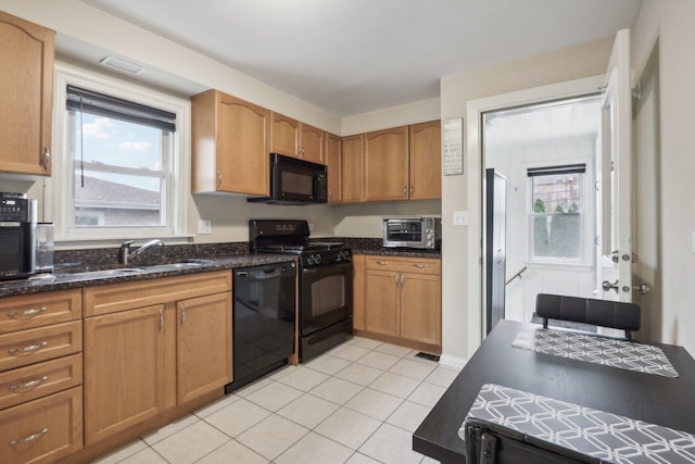 8122 W Oak Ave, Niles, IL 60714 - kitchen featuring black appliances, a sink, light tile patterned floors, dark stone countertops, and brown cabinets