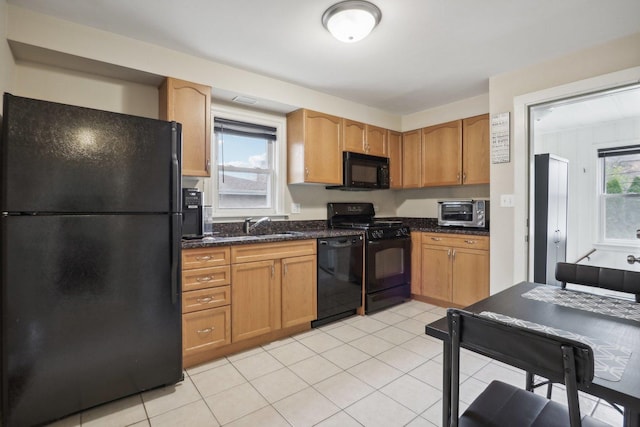 8122 W Oak Ave, Niles, IL 60714 - kitchen featuring black appliances, dark stone countertops, a sink, and light tile patterned floors