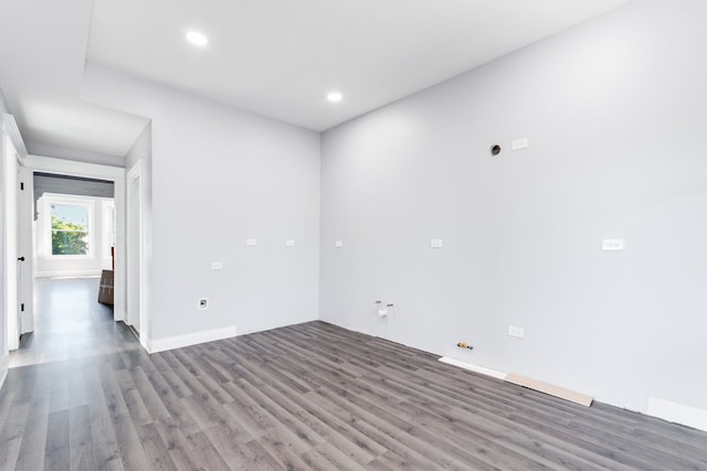 unfurnished room with wood-type flooring