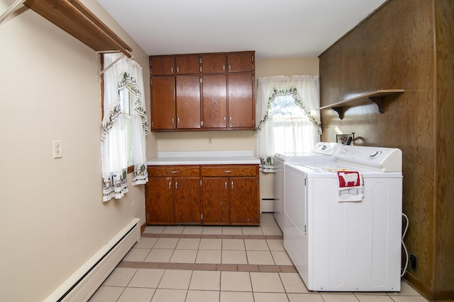 76 S 7000w Rd, Kankakee, IL 60901 - laundry room featuring washer and clothes dryer, cabinet space, a baseboard heating unit, and light tile patterned floors