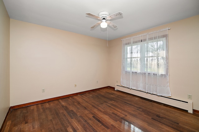 unfurnished room with ceiling fan, baseboard heating, and dark hardwood / wood-style floors