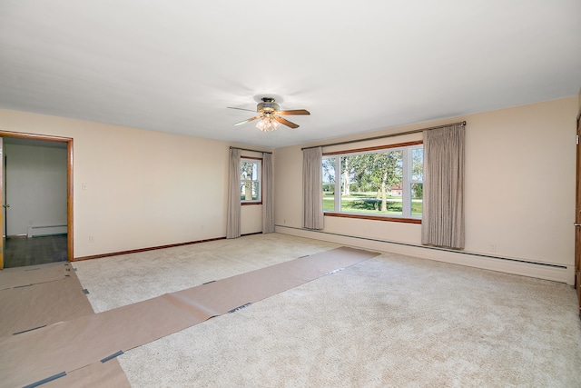 unfurnished room featuring a baseboard radiator, ceiling fan, and light colored carpet