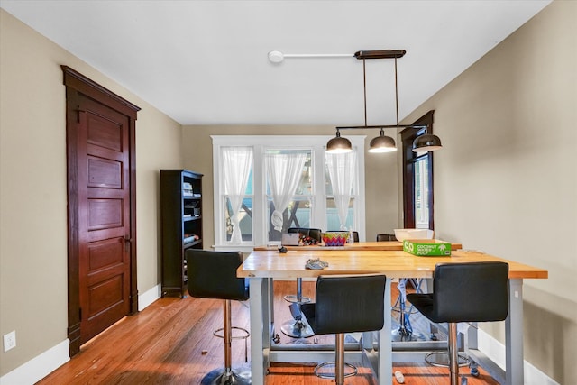 dining room with hardwood / wood-style floors