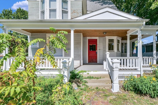 entrance to property featuring covered porch