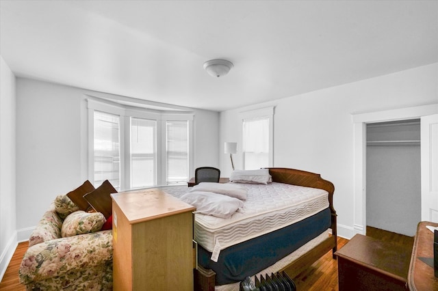 bedroom featuring a closet and hardwood / wood-style flooring